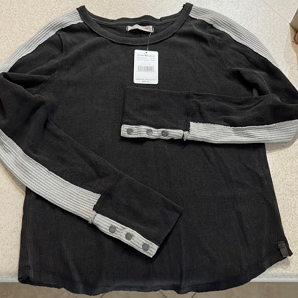 Free People thermal like top with button detail on sleeves. Brand new.